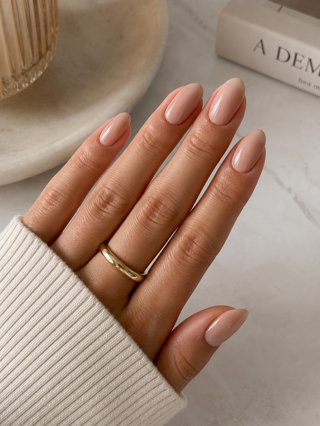Nude almond nails with a high-shine finish